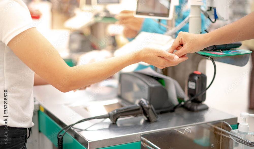 Female hand with coin money pay for goods concept. Hand giving cash and hand receiving cash. Female hand with coin money pay for goods concept. Hand giving cash and hand receiving cash.