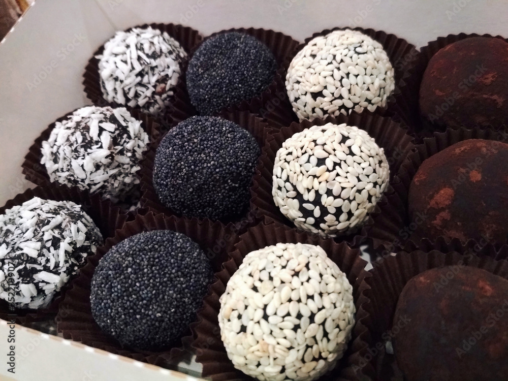 Chocolate fruit sweets coconut flakes poppy sesame food tasty dessert macro photo Chocolate fruit sweets coconut flakes poppy sesame food tasty dessert macro photo
