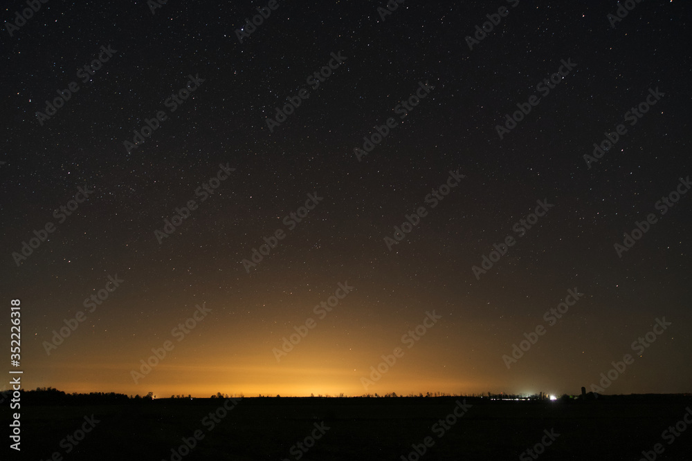 A starry night over a farmers field