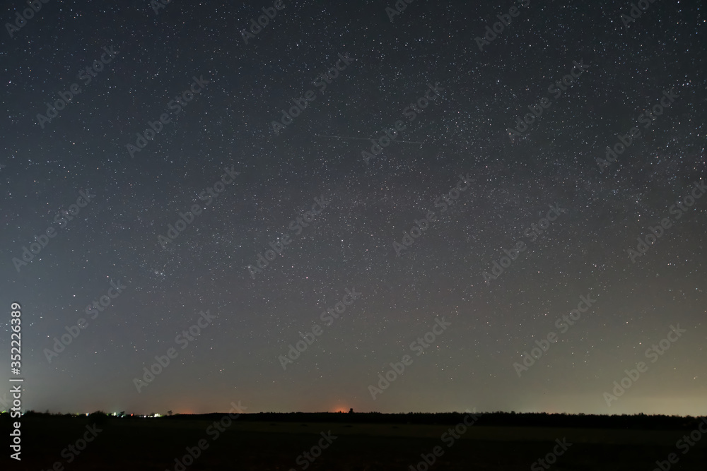 A starry night over a farmers field
