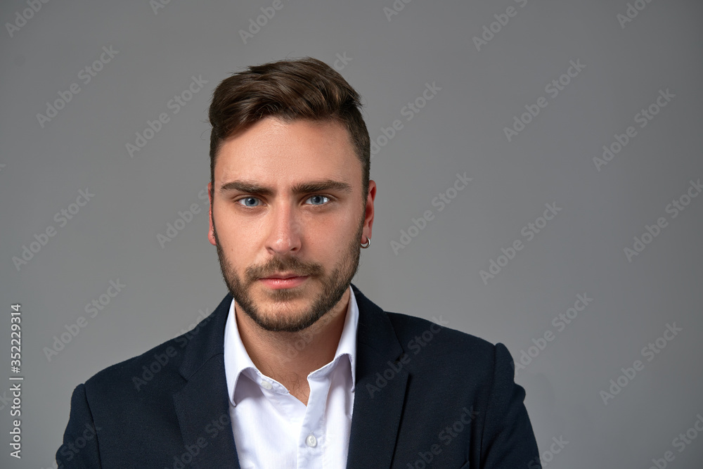 Close up portrait young man businessman. Caucasian guy business suit studio gray background. Close up portrait young man businessman. Caucasian guy business suit studio gray background.