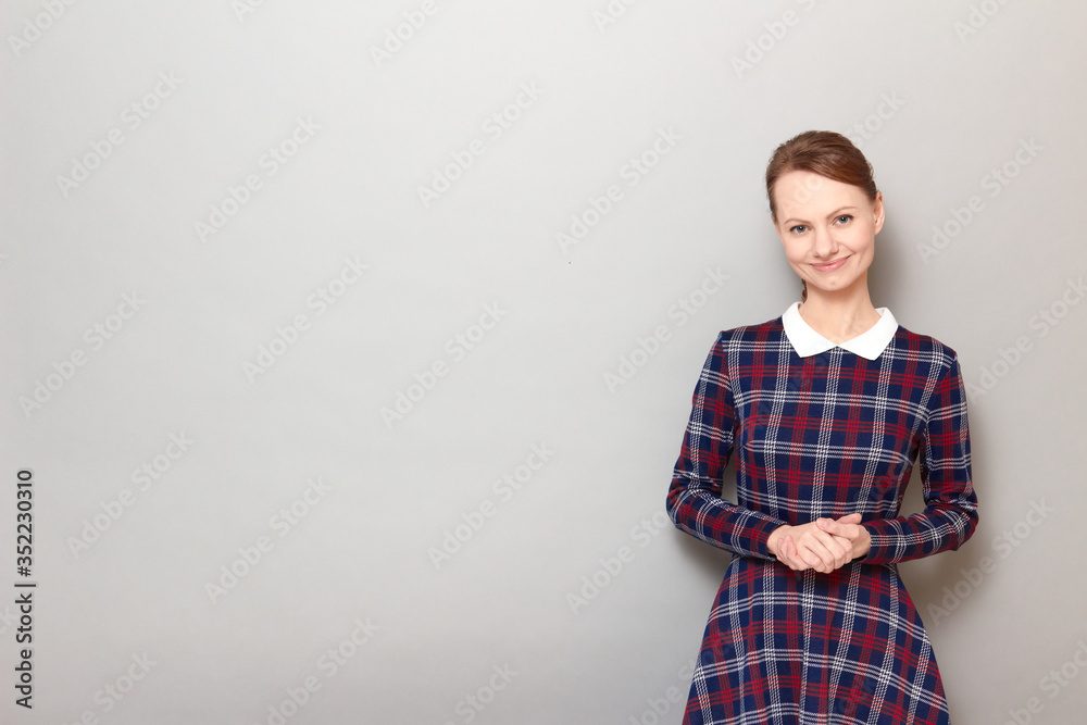 Portrait of happy girl holding hands clasped together and smiling Portrait of happy girl holding hands clasped together and smiling