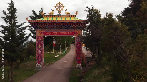 Aerial footage getting closer to the entrance gate of the Tibetan Buddhist temple of Dag Shang Kagyu located in Panillo, Spain photo