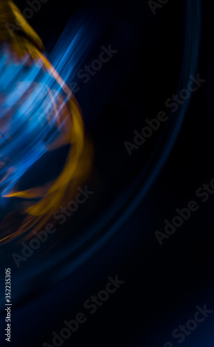 Macro shot of light bulb with abstraction lines on dark background