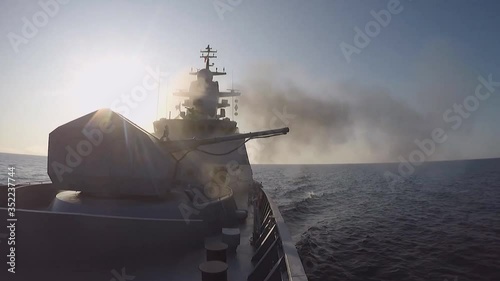 View from the side of a warship at firing from cannons (GoPro) photo