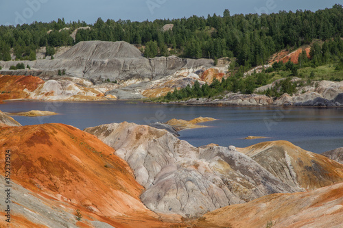 Amazing kaolin clay marsian landscape quarry open pit at summer day