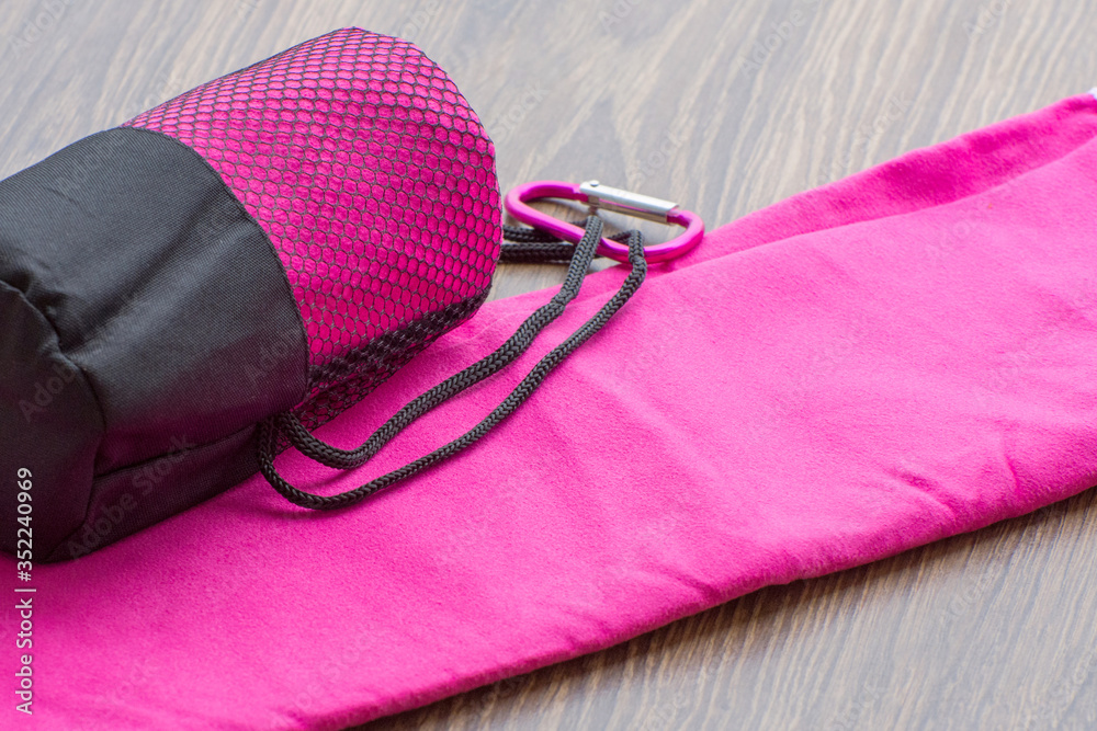 Naklejka premium Pink microfiber towel for fitness and outdoor walks.