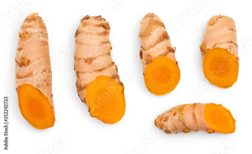 turmeric root and slices isolated on white background. Top view. Flat lay