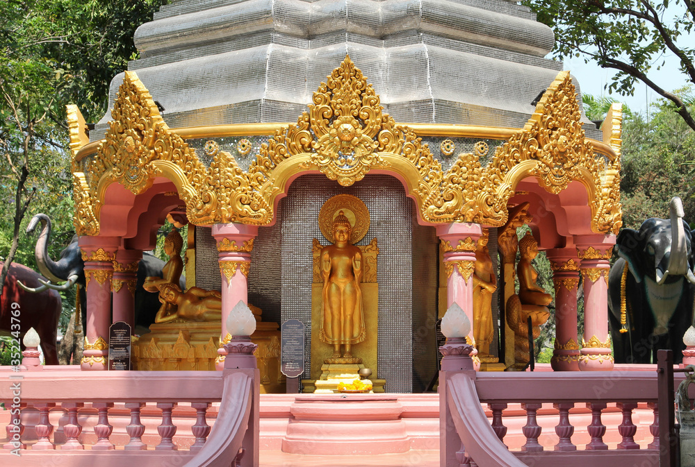 Fototapeta premium Buddha statue in a golden chedi in the Erawan Museum a private museum, Samut Prakan province, Thailand.