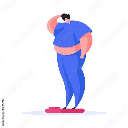 Overweight man standing on scales at home