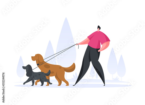 Happy man walking with dogs in park