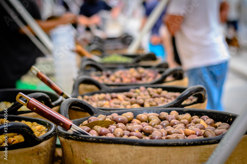 Variety of marinated olives at the market. photo