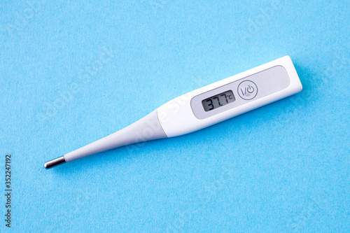 detail of digital thermometer with 37,7 °C of fever