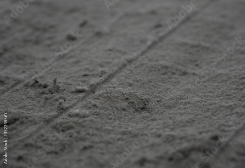 Fotografie A sheet of panel filter of air condition with a lot of dust on white background