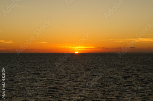 Sunset/sunrise on the ocean. Seen from a cruise