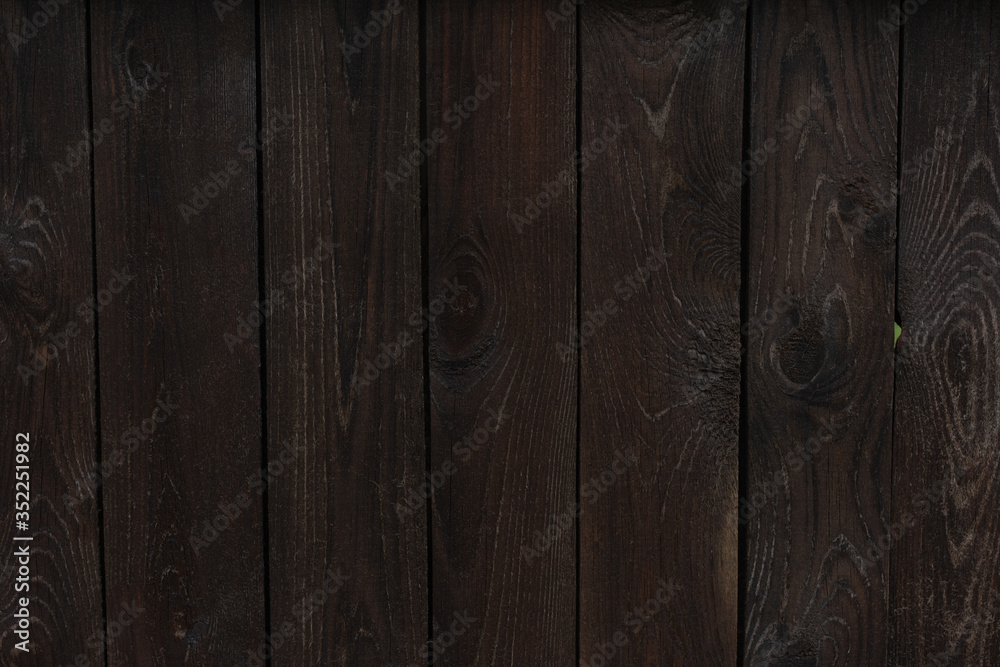 Fototapeta premium wet brown country wooden fence