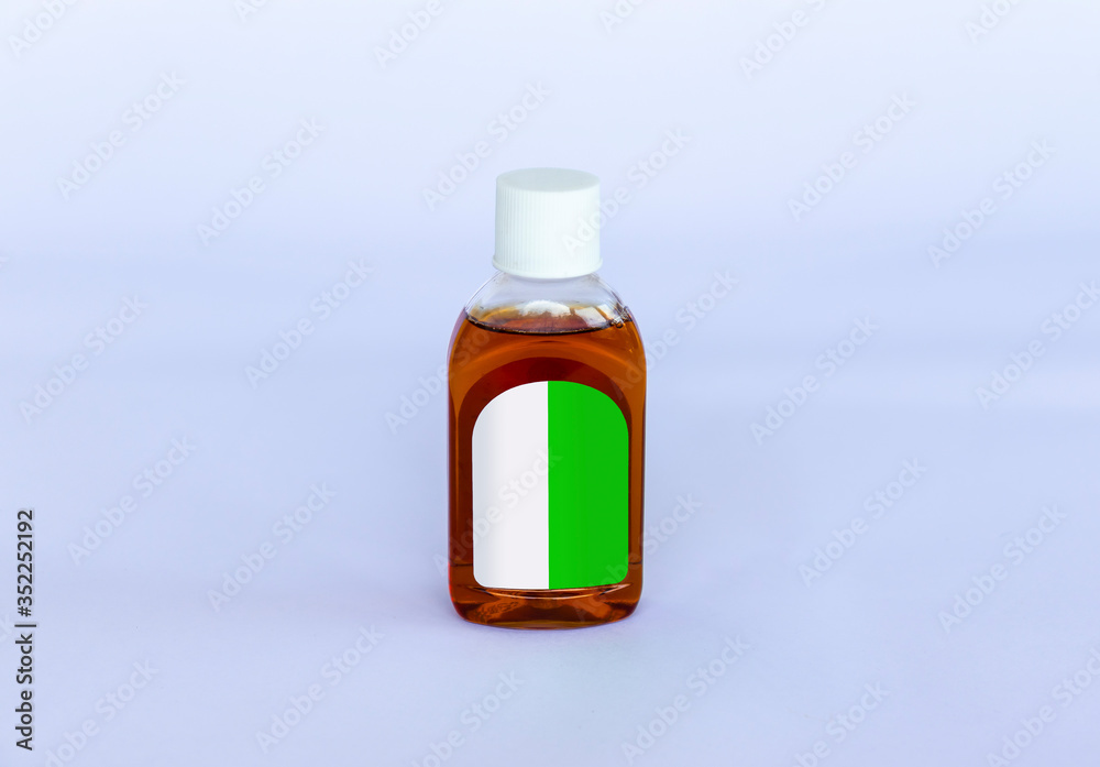 Small isolated Antiseptic Liquid bottle on a neutral background