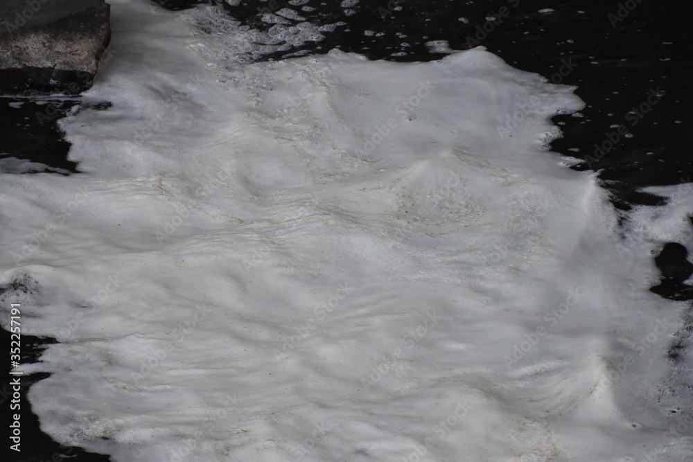 water foam in a stream