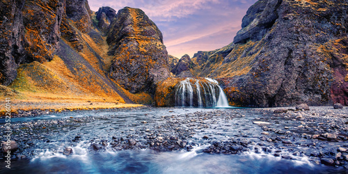 Stjornarfoss Waterfall in South Iceland. Incredible nature landscape with colorful sky during sunset. Iconic location for landscape photographers and bloggers. Best famouse travel locations. Wallpaper