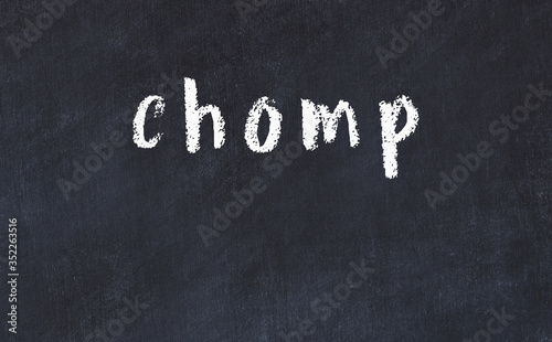 Black chalkboard with inscription chomp on in