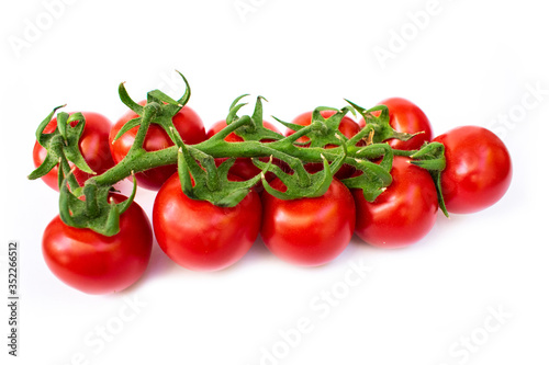Fresh red cherry tomatoes on the white background
