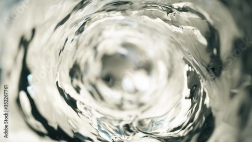Water moves in a glass in slow motion