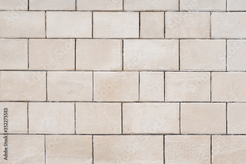 Texture of a white freestone wall 