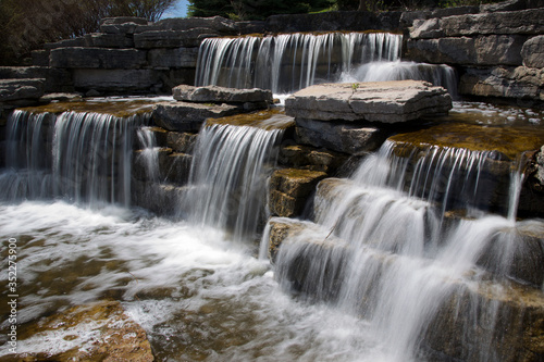 spring - flowing water - waterfall in the public park at Richmond Hill  Ontario  Canda