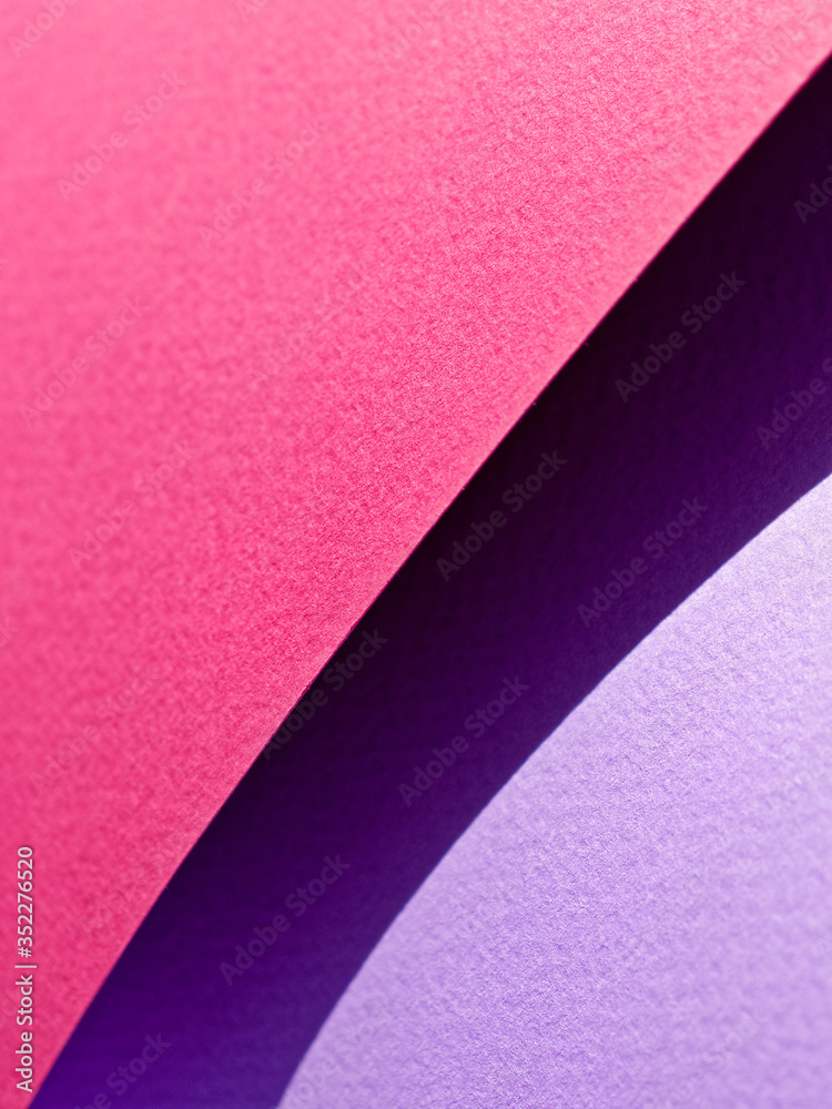 Abstract background made of red and purple sheets of thick paper twisted together. Shallow depth of field. Abstract background made of red and purple sheets of thick paper twisted together. Shallow depth of field.