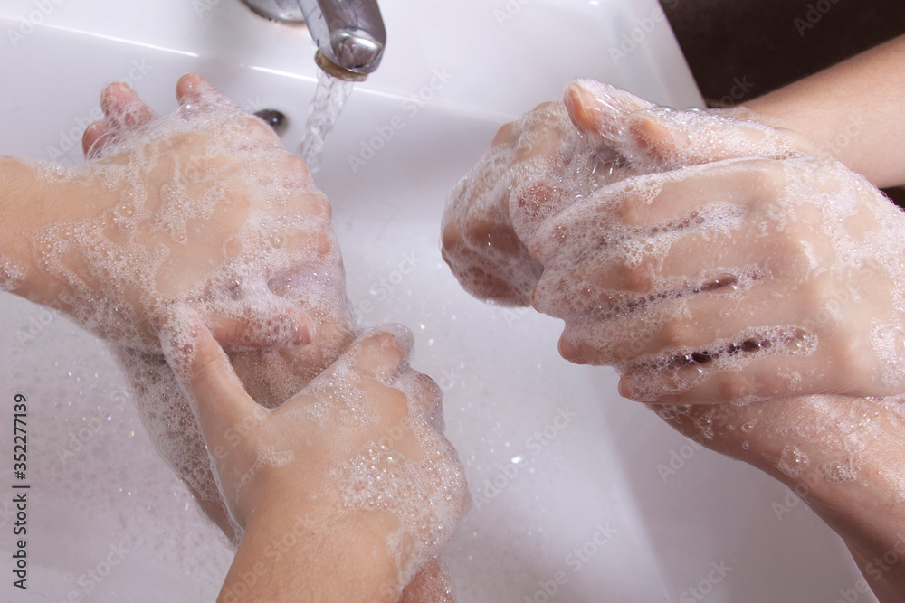 Fototapeta premium Good hygiene - a great habit - cleaning the hands of three young women