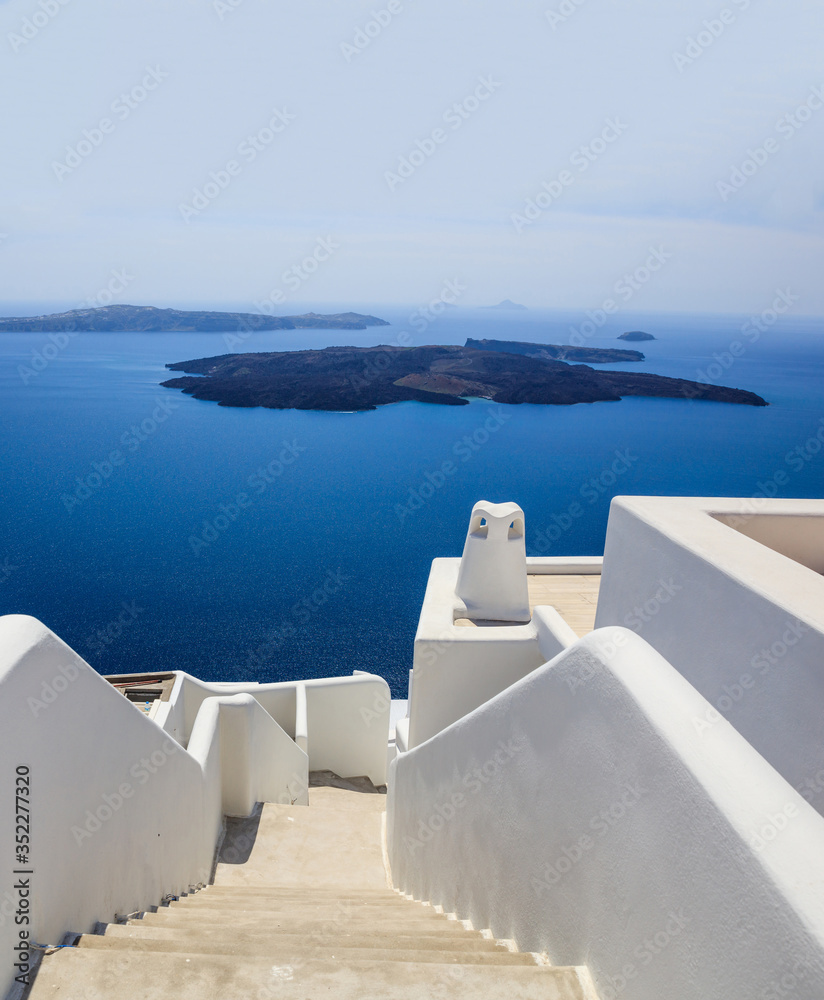 Fototapeta Santorini, Greece. White architecture against blue sea and sky background.