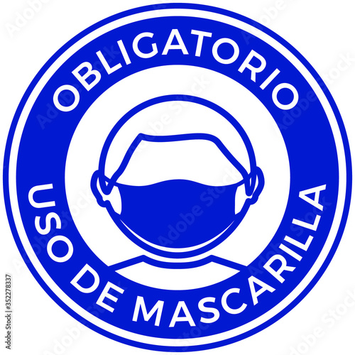 Round sign of a Man wearing protective face mask icon and spanish phrase: obligatory use of mask. Protection against Coronavirus, COVID-19 virus, flu and air pollution. Flat vector illustration