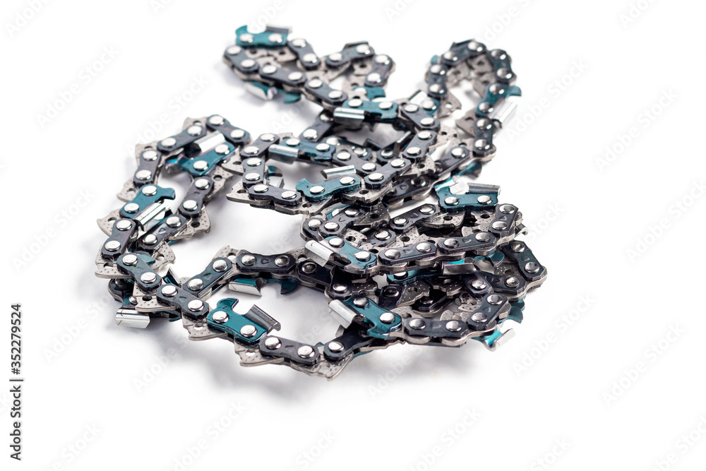 On white background. metal chain for chainsaw. Close-up. Horizontal photo On white background. metal chain for chainsaw. Close-up. Horizontal photo