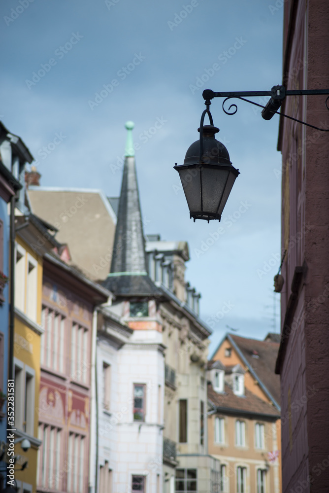 Closeup of vintage street lamp on historical architecture on the main place in Mulhouse - France