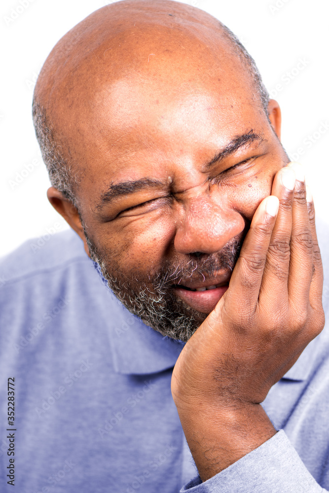 African American Man having tooth ache touching cheek. Senior with toothache. Isolated on white background African American Man having tooth ache touching cheek. Senior with toothache. Isolated on white background