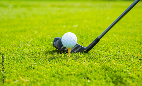 golf ball ang club on golf green grass natural fairway