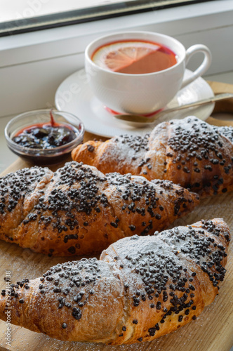  croissants with chocolate and a cup of tea