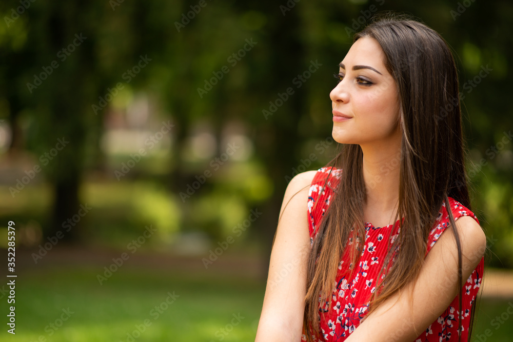 Young smiling woman in a park Young smiling woman in a park