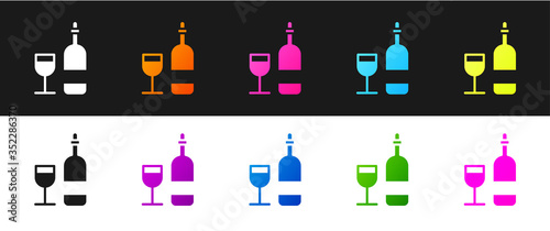 Set Wine bottle with glass icon isolated on black and white background. Vector
