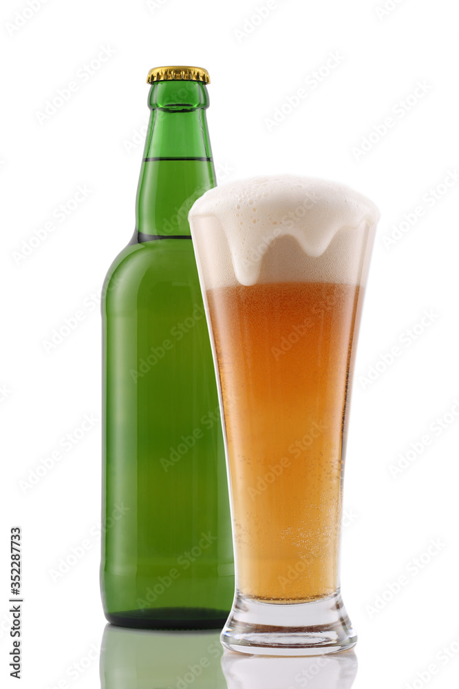 Glass and bottle of beer isolated on white