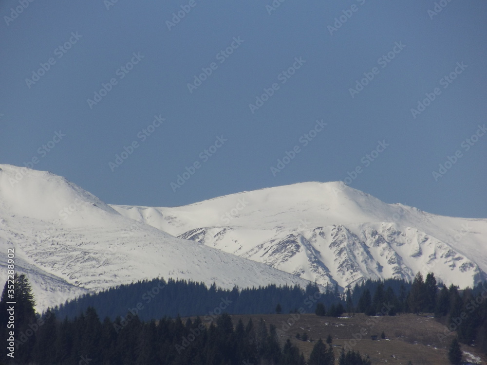 The mountain tops are covered with snow