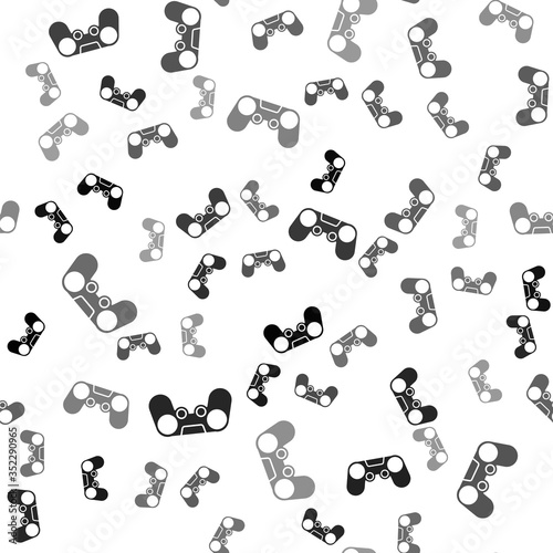 Black Gamepad icon isolated seamless pattern on white background. Game controller. Vector