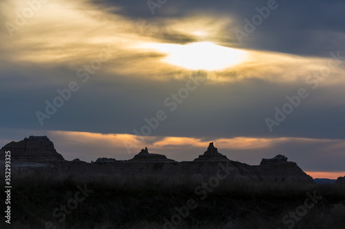 Landscape view of a colorful sunset in Badlands National Park in South Dakota .