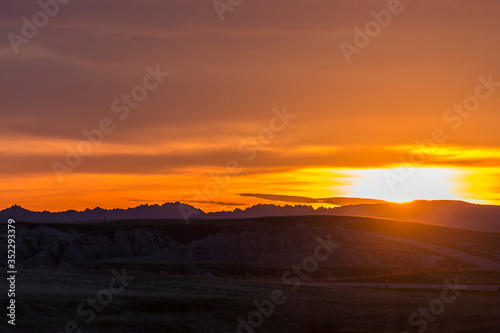 Landscape view of a colorful sunset in Badlands National Park in South Dakota).