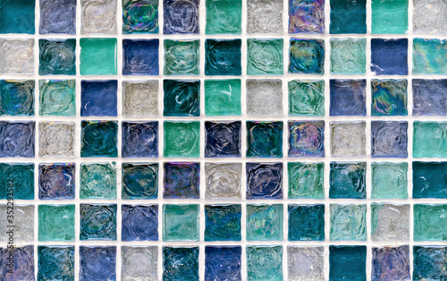 Ceramic mosaic tiles with blue, turquoise and white embossed squares for the decor of the kitchen, bathroom or pool.