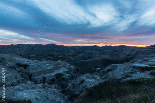 Landscape view of a colorful sunset in Badlands National Park in South Dakota).