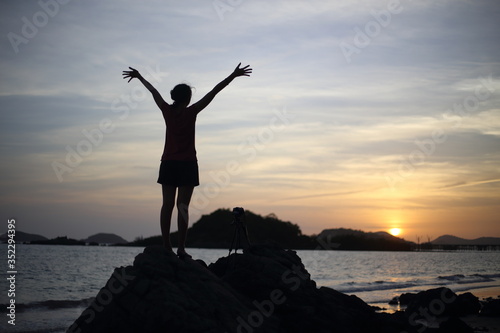 Women wait photography sunset at the beach