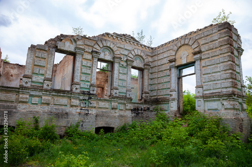 The ruins of the Palace von der Osten Saken on the border of the town of Nemeshaevo and the village of Mirotskoye, Kiev region, Ukraine. Abandoned old manor. The remains of a brick house. © Real_life