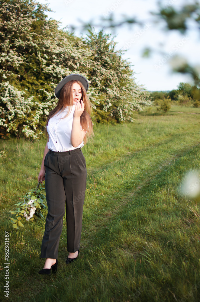 Happy girl with long hair walking in the spring Happy girl with long hair walking in the spring