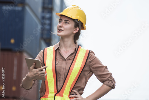 Worker is checking warehouse by using tablet